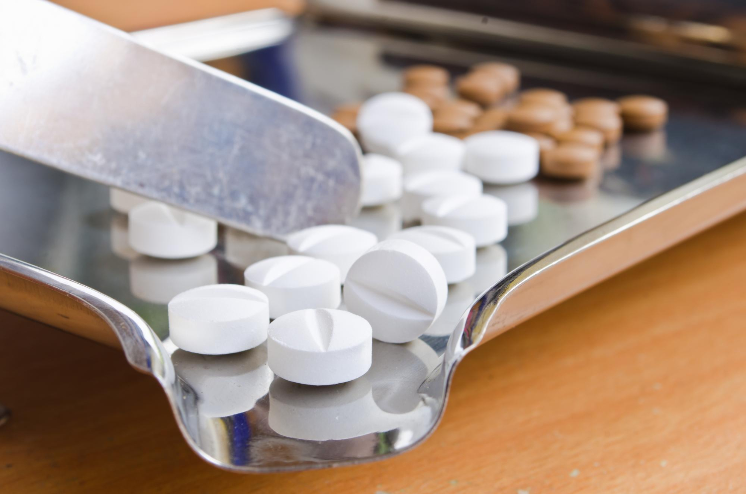Pharmaceutical tablets on a stainless tray